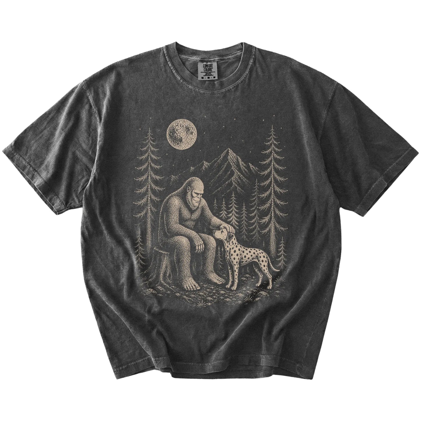 Bigfoot petting a Dalmatian beneath the moon in a pine forest on a Pepper Comfort Colors® T-shirt