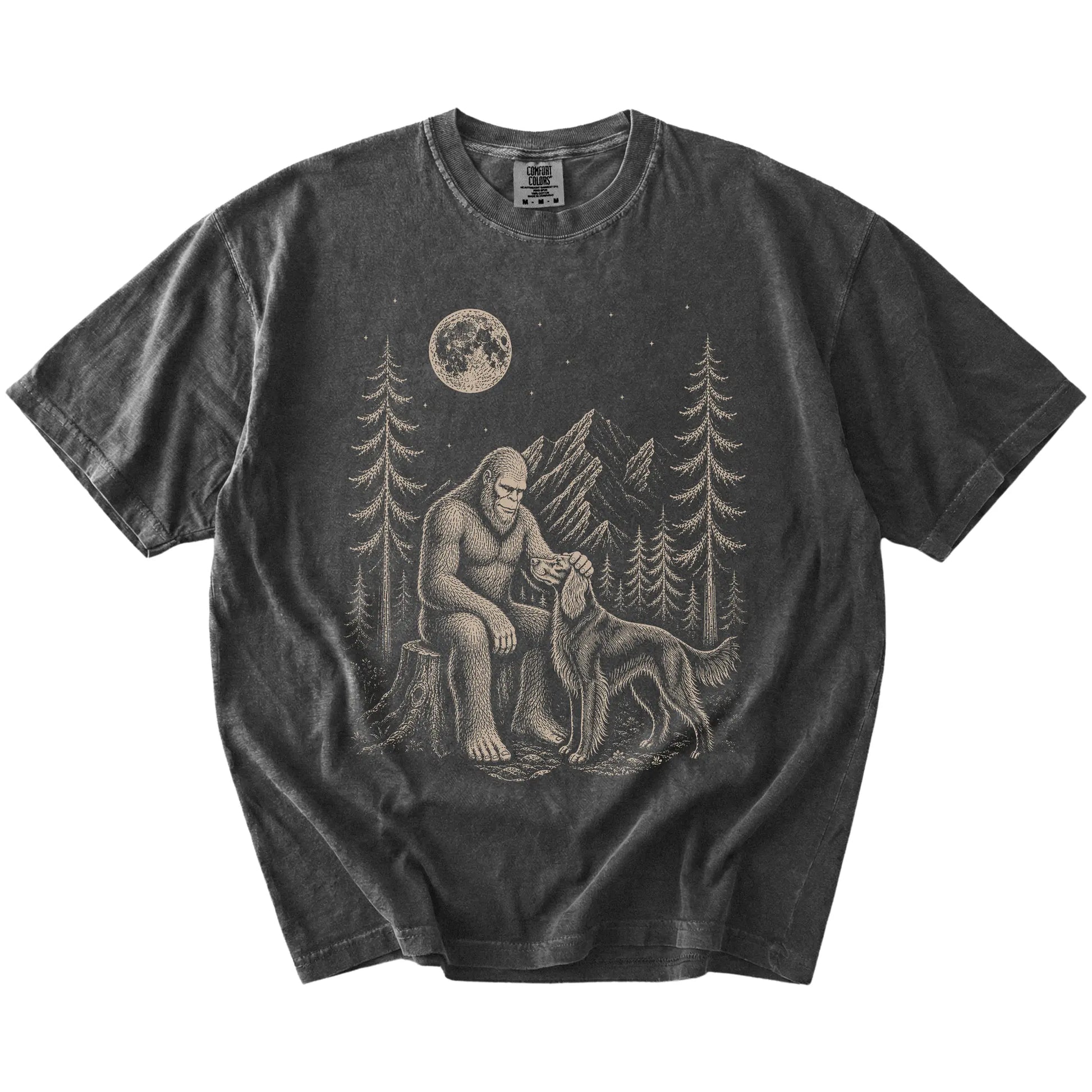 Bigfoot petting a Irish Setter beneath the moon in a pine forest on a Pepper Comfort Colors® T-shirt
