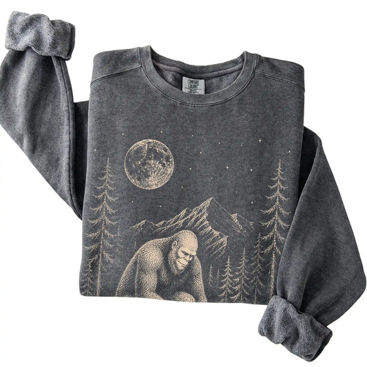 Pepper Comfort Colors sweatshirt featuring Bigfoot petting a Pomeranian