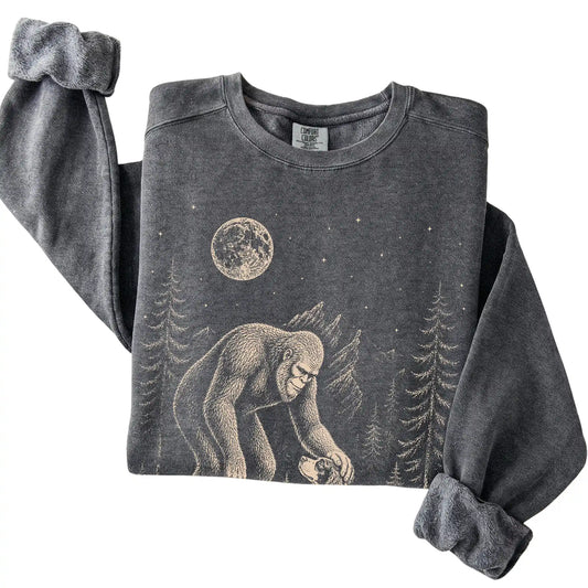 Pepper Comfort Colors sweatshirt featuring Bigfoot petting a Springer Spaniel