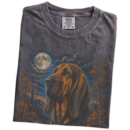 Folded Pepper Comfort Colors® t-shirt showing Bloodhound in a fall forest graphic