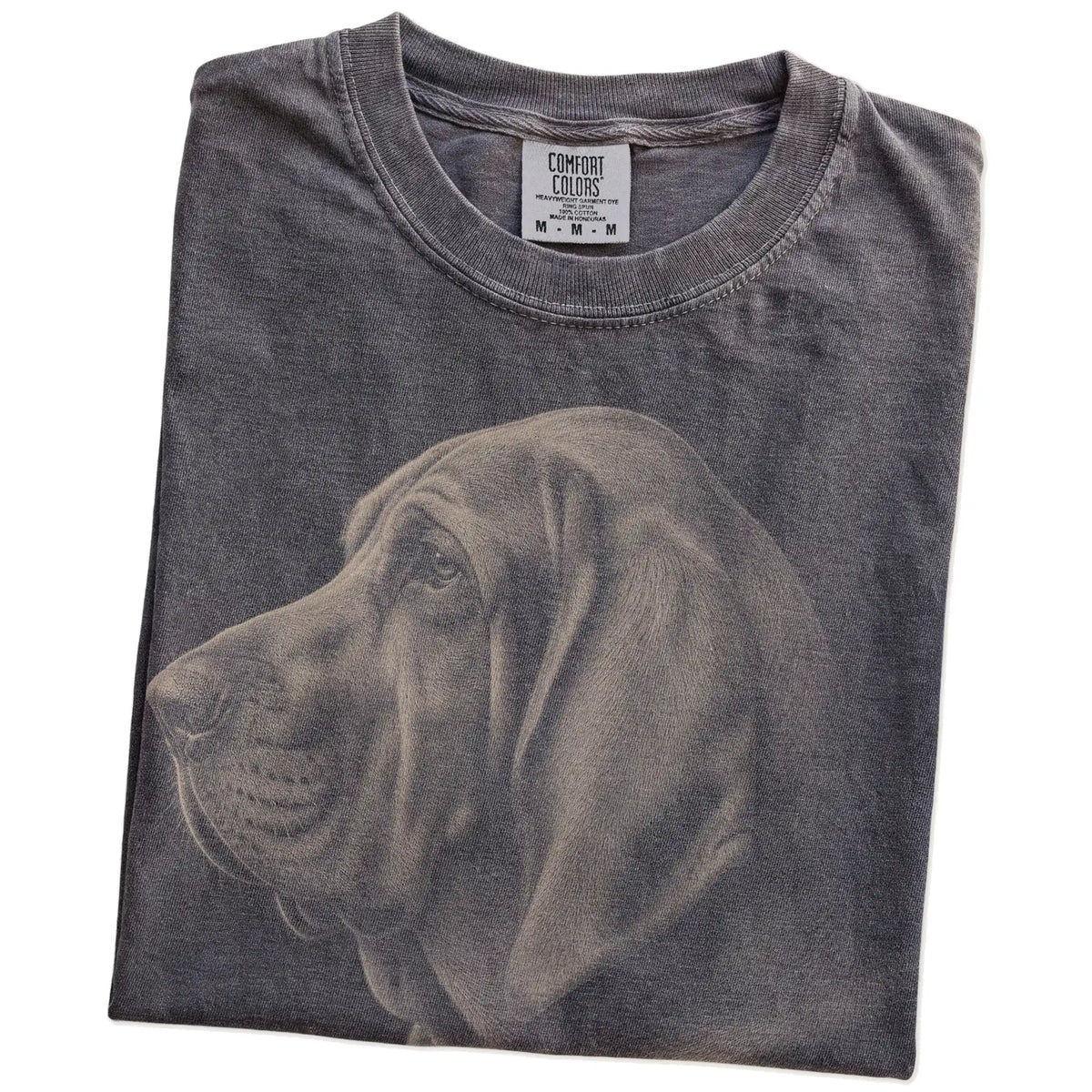 Folded Pepper Comfort Colors® T-shirt showing a detailed photographic portrait of a Bloodhound