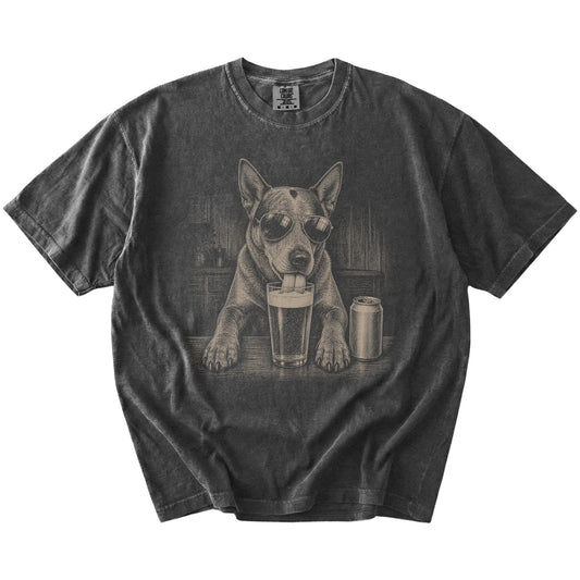 Blue Heeler sneaking a drink from a foamy pint at home on a Pepper Comfort Colors® t-shirt