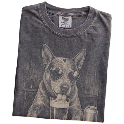 Folded Pepper Comfort Colors® t-shirt showing Blue Heeler sneaking a drink from a pint