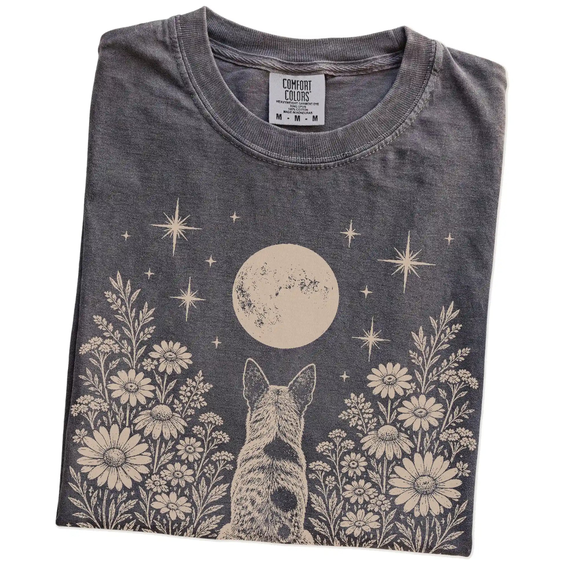 Folded Pepper Comfort Colors® T-shirt showing Blue Heeler beneath a wildflower moon