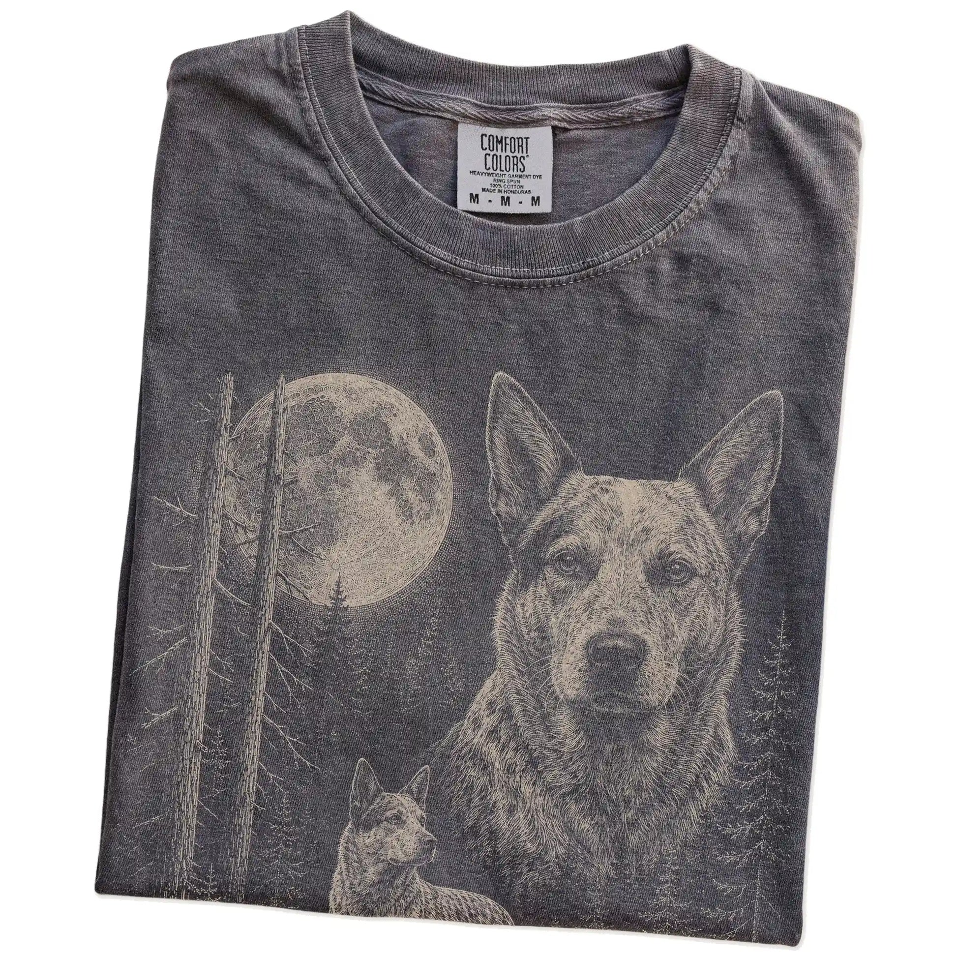 Folded Pepper Blue Heeler Moonlit Forest T-Shirt showing the graphic