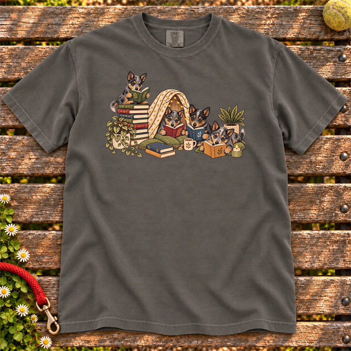 Blue Heeler puppies reading books in a cozy blanket fort on a Pepper T-shirt