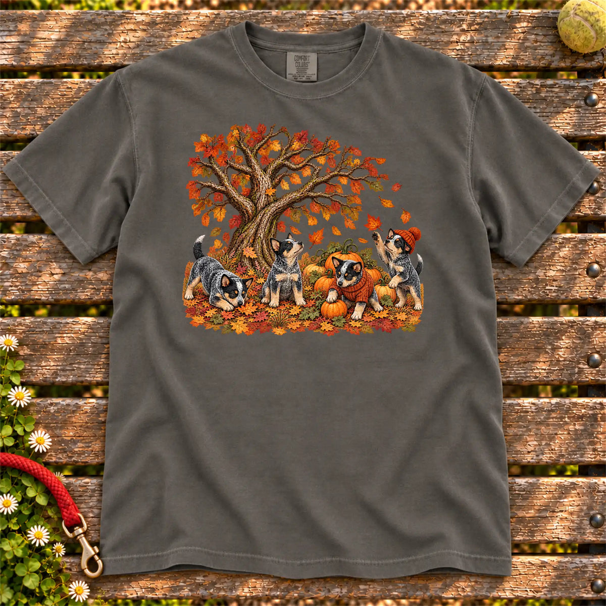 Four Blue Heeler puppies with pumpkins beneath an autumn tree on a Pepper garment-dyed T-shirt