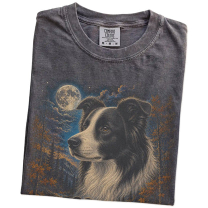 Folded pepper T-shirt with Border Collie Autumn Moon artwork.