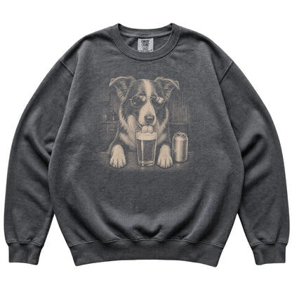 Pepper Border Collie drinking from a pint at a bar, laid flat