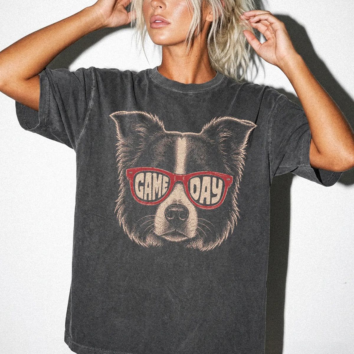 Model wearing a Pepper Comfort Colors® T-shirt with border collie wearing red game day sunglasses