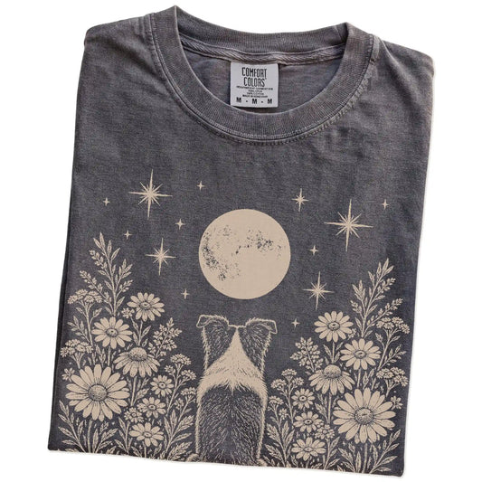 Folded Pepper Comfort Colors® T-shirt showing Border Collie beneath a wildflower moon