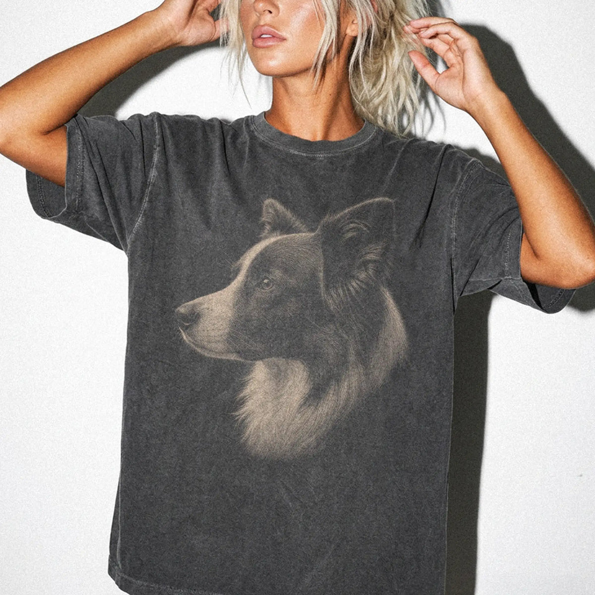 Model wearing a Pepper Comfort Colors® T-shirt with a detailed photographic portrait of a Border Collie