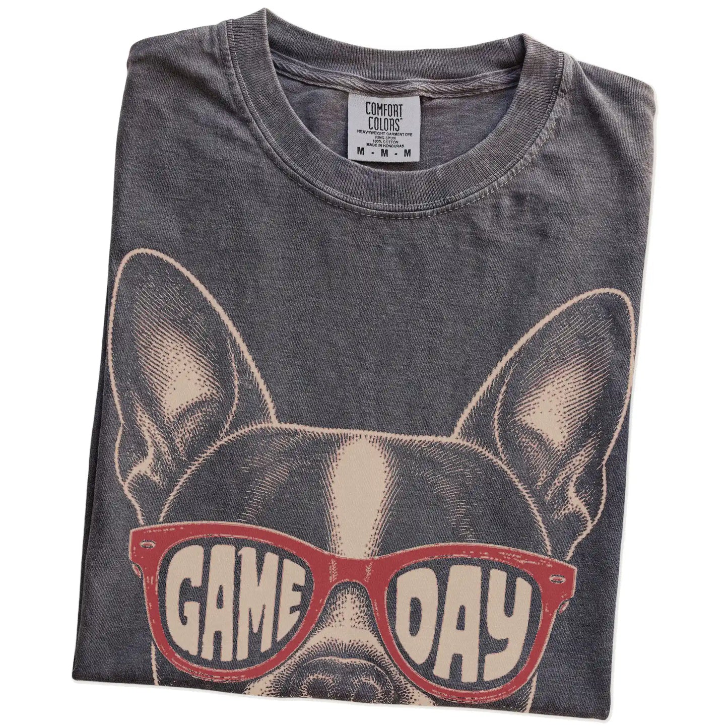 Folded Pepper Comfort Colors® T-shirt showing boston terrier wearing red game day sunglasses