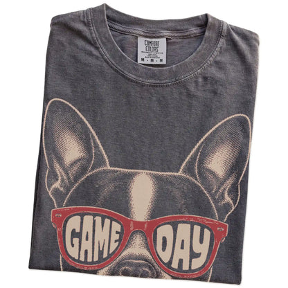 Folded Pepper Comfort Colors® T-shirt showing boston terrier wearing red game day sunglasses