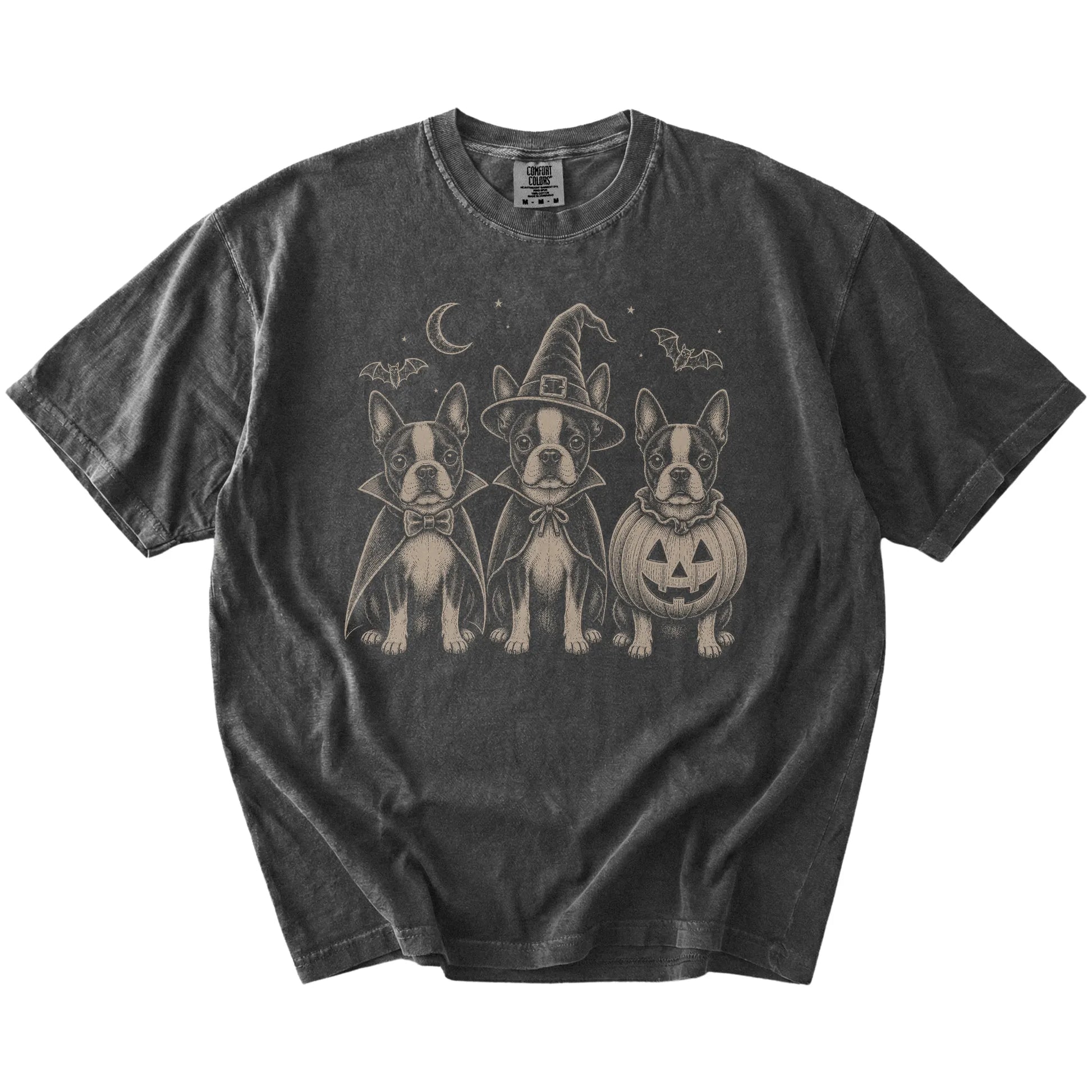 Three Boston Terrier dogs dressed for Halloween beneath bats and a crescent moon on a Pepper Comfort Colors® T-shirt