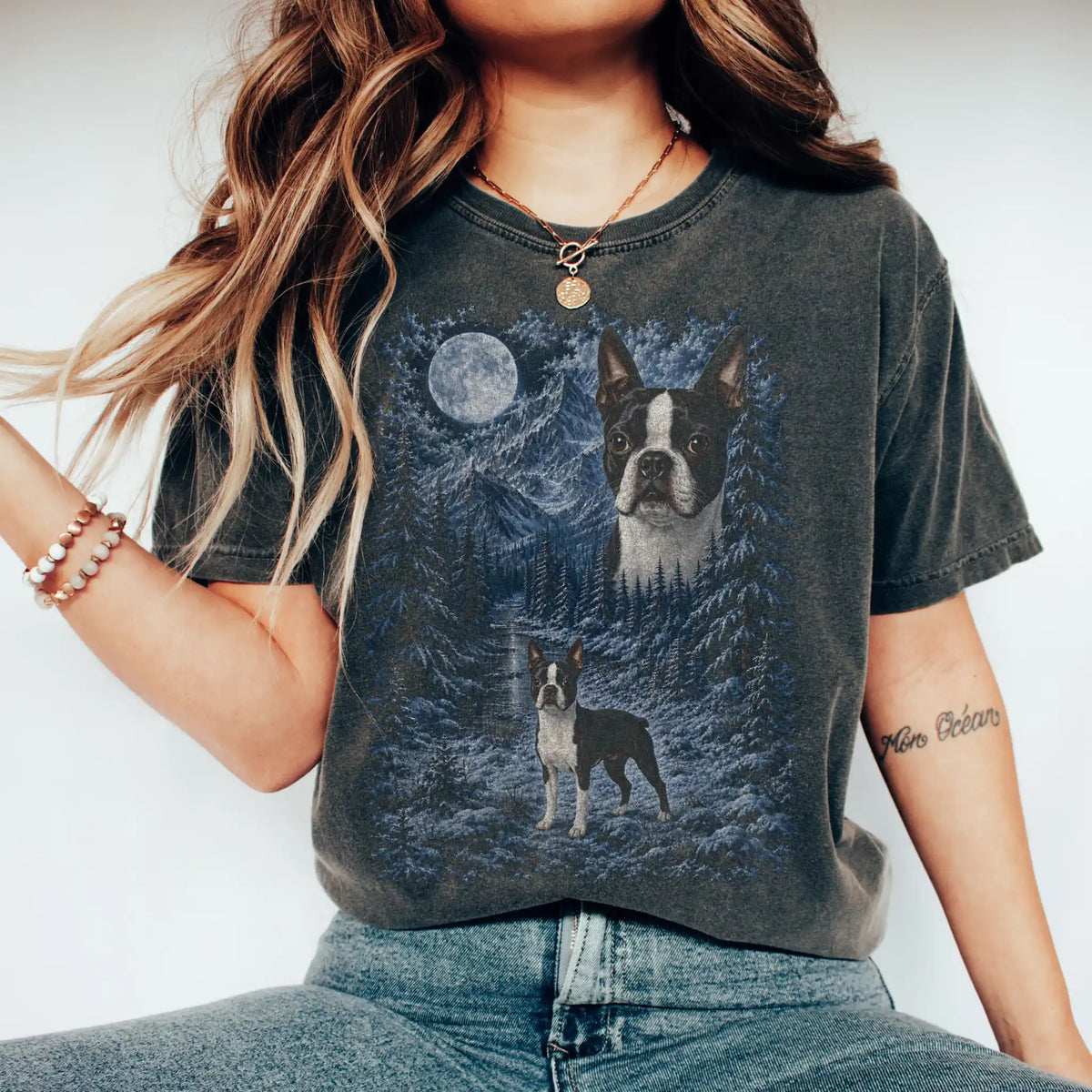 Model wearing a pepper T-shirt with Boston Terrier Winter Moon artwork.