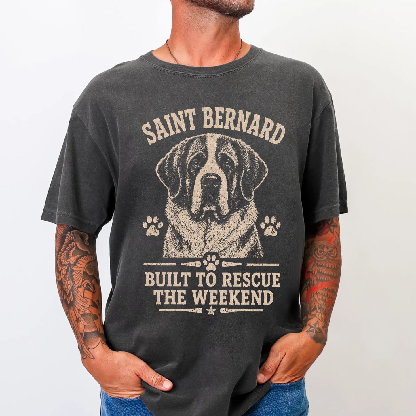 Model wearing a Pepper Comfort Colors® T-shirt featuring Saint Bernard design with “Built To Rescue The Weekend” lettering