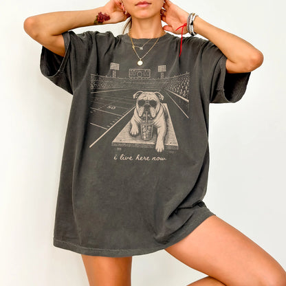 Model wearing a Pepper Comfort Colors® T-shirt featuring Bulldog ready for football and tailgate season