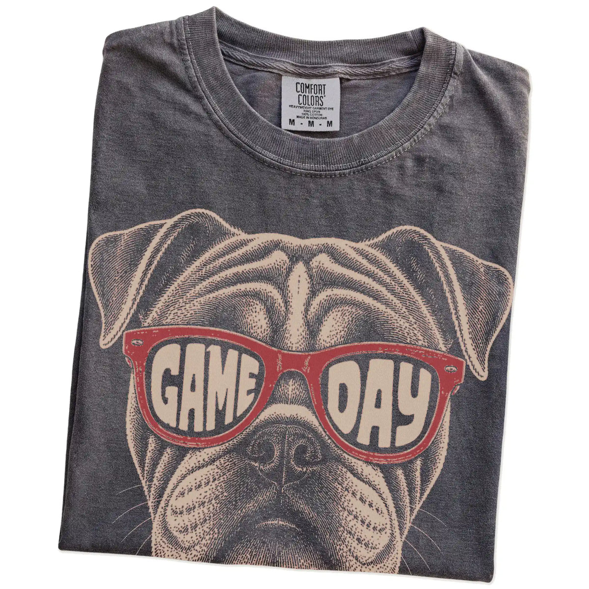 Folded Pepper Comfort Colors® T-shirt showing bulldog wearing red game day sunglasses
