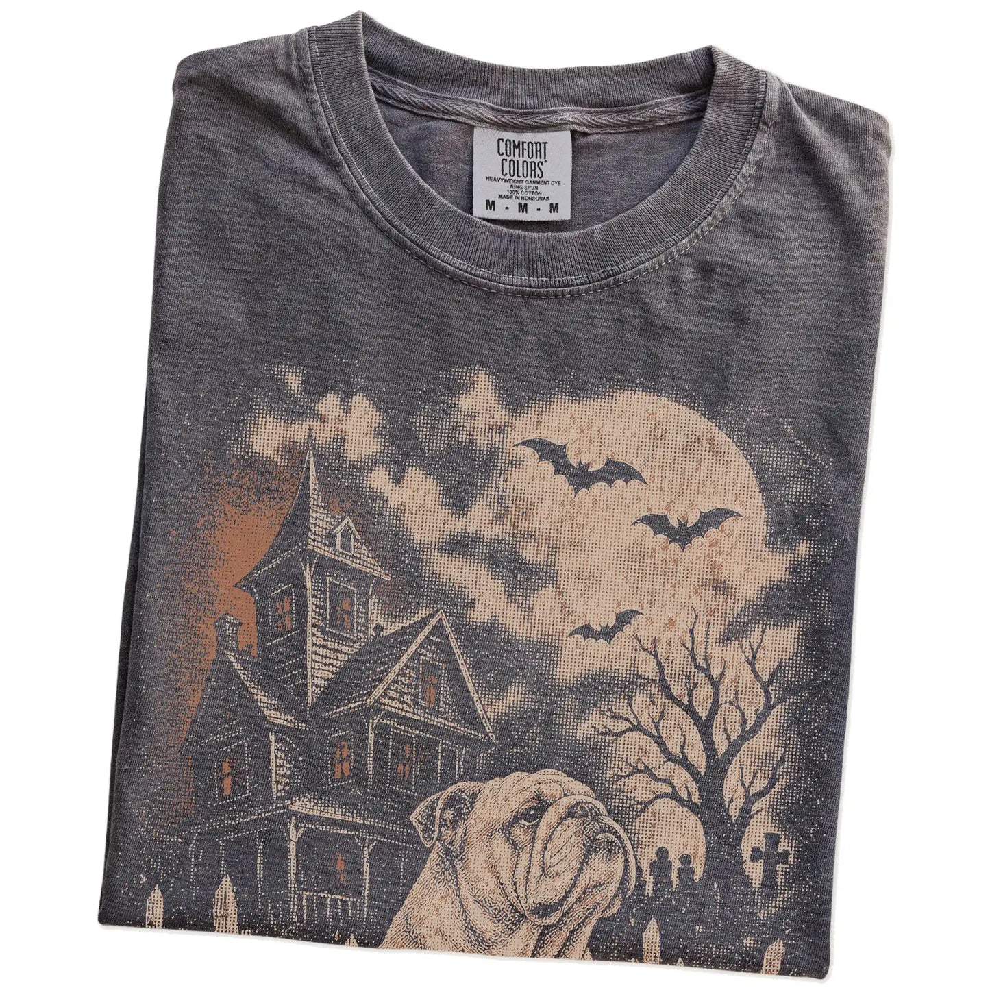 Folded Pepper Comfort Colors® T-shirt showing Bulldog in a vintage haunted-house scene