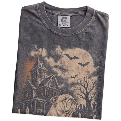 Folded Pepper Comfort Colors® T-shirt showing Bulldog in a vintage haunted-house scene