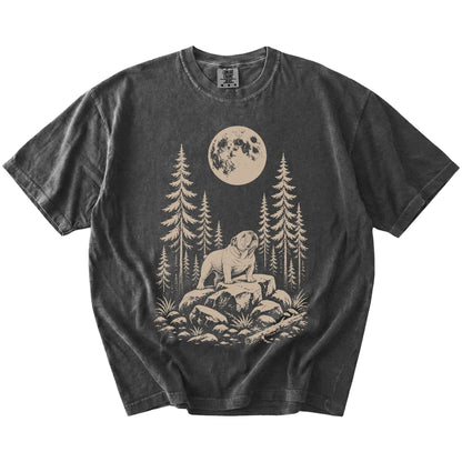 Bulldog howling beneath the moon and pine trees on a Pepper Comfort Colors® T-shirt