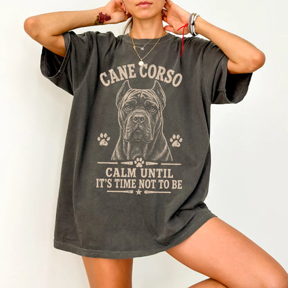 Model wearing a Pepper Comfort Colors® T-shirt featuring Cane Corso design with “Calm Until It's Time Not To Be” lettering
