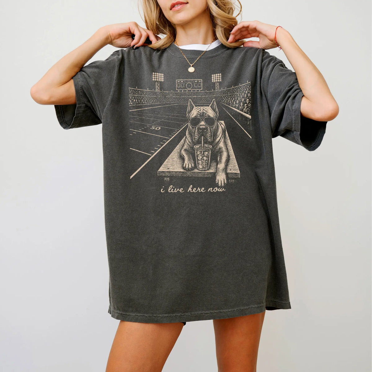 Model wearing a Pepper Comfort Colors® T-shirt featuring Cane Corso ready for football and tailgate season