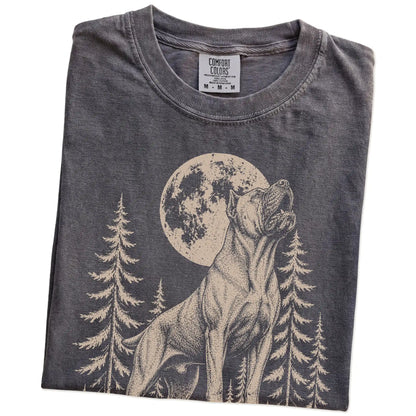 Folded Pepper Comfort Colors® T-shirt showing a Cane Corso howling beneath the moon and pine trees