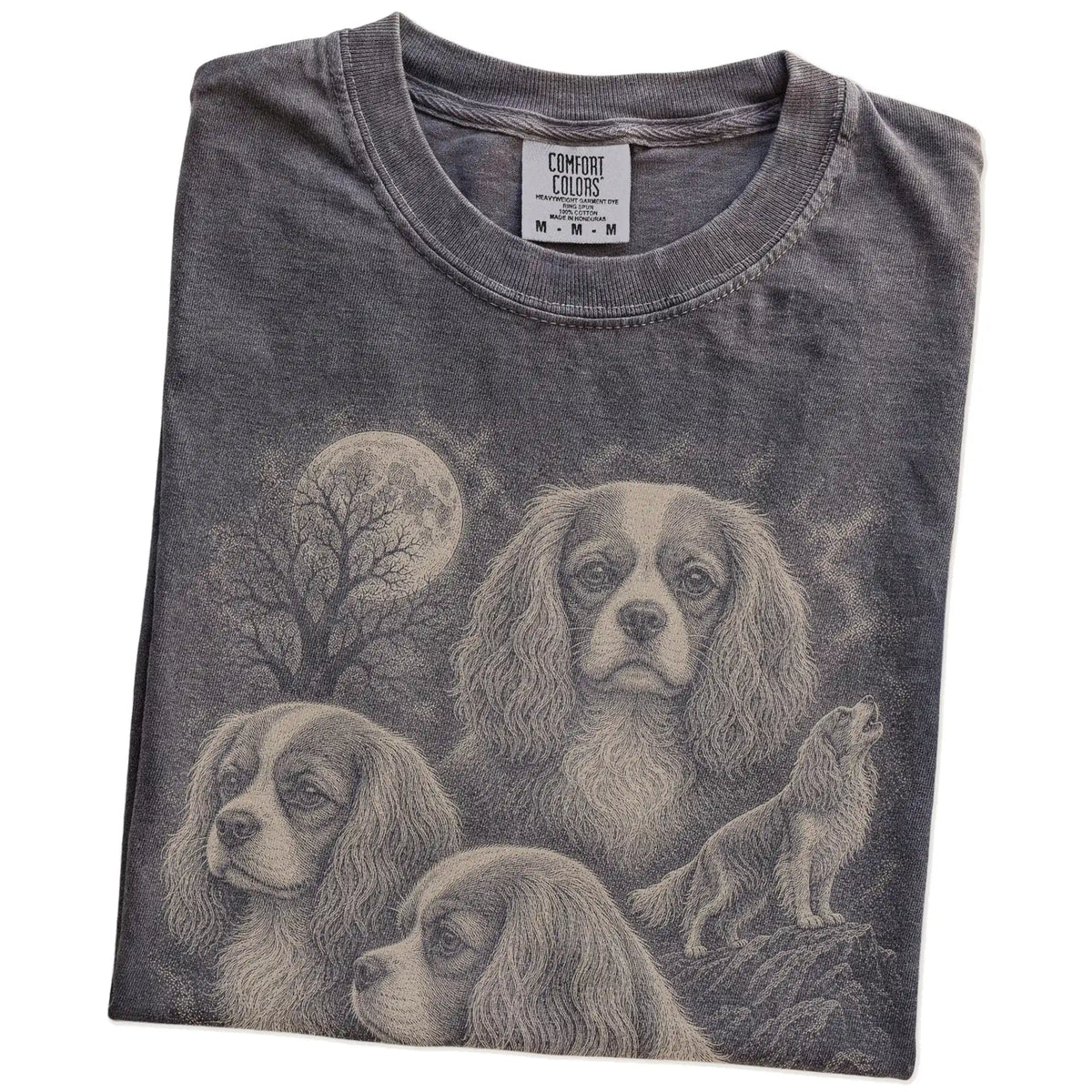 Folded Pepper Comfort Colors® T-shirt showing a vintage moon montage featuring Cavalier King Charles Spaniel