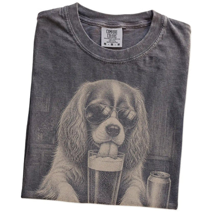 Folded Pepper Comfort Colors® t-shirt showing Cavalier King Charles Spaniel sneaking a drink from a pint