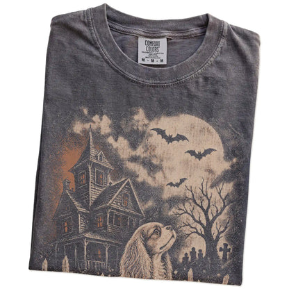 Folded Pepper Comfort Colors® T-shirt showing Cavalier King Charles Spaniel in a vintage haunted-house scene