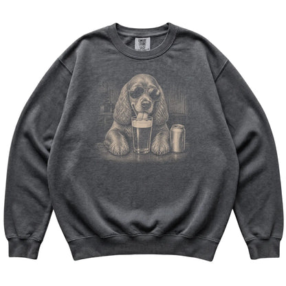 Pepper Cocker Spaniel drinking from a pint at a bar, laid flat