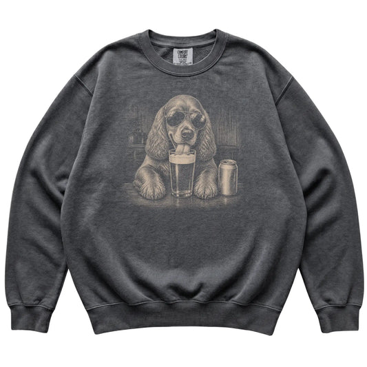 Pepper Cocker Spaniel drinking from a pint at a bar, laid flat