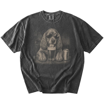 Cocker Spaniel sneaking a drink from a foamy pint at home on a Pepper Comfort Colors® t-shirt