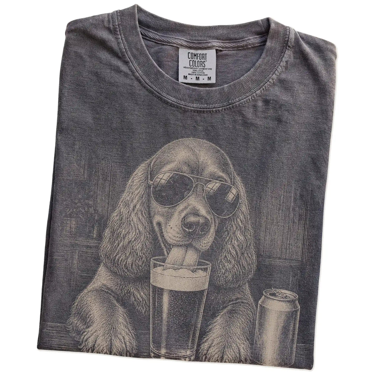 Folded Pepper Comfort Colors® t-shirt showing Cocker Spaniel sneaking a drink from a pint