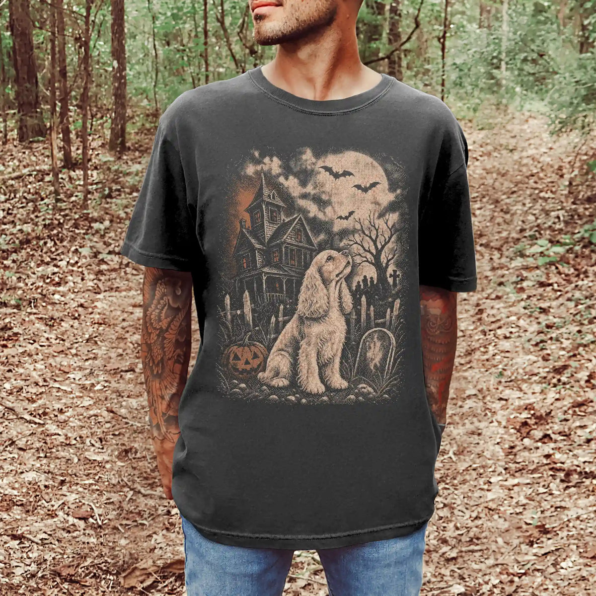 Model wearing a Pepper Comfort Colors® T-shirt showing Cocker Spaniel in a vintage haunted-house scene