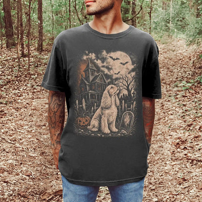 Model wearing a Pepper Comfort Colors® T-shirt showing Cocker Spaniel in a vintage haunted-house scene