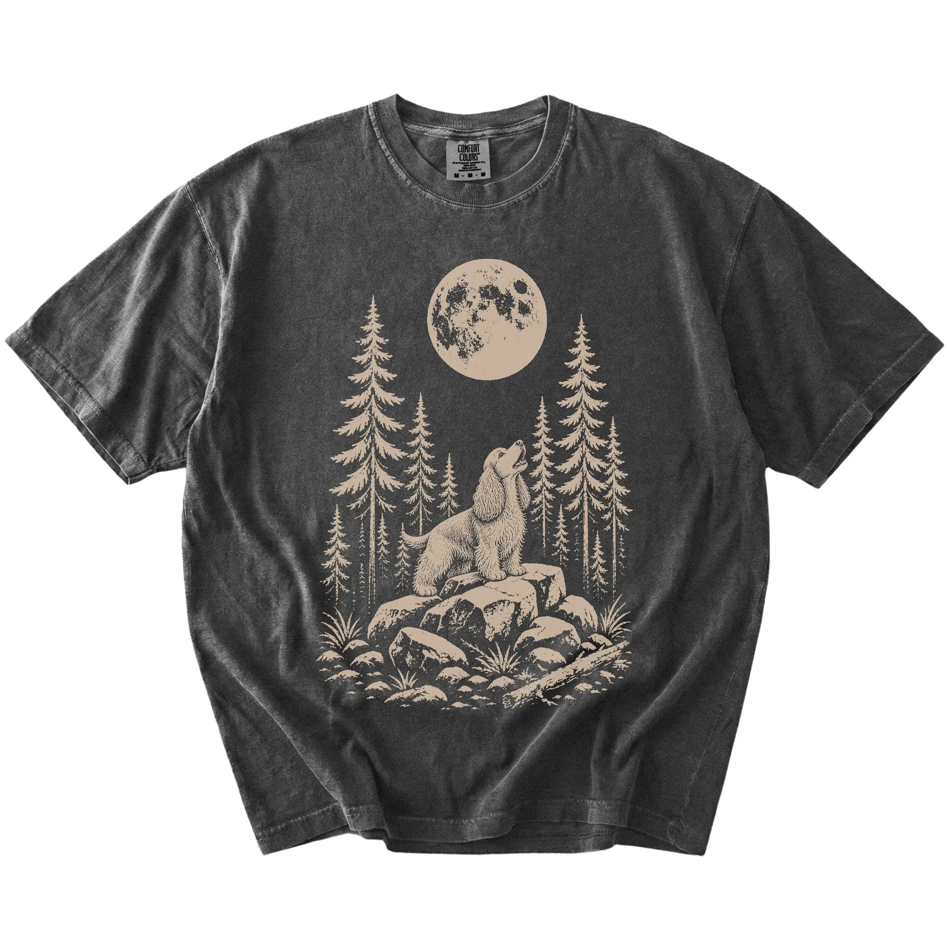 Cocker Spaniel howling beneath the moon and pine trees on a Pepper Comfort Colors® T-shirt