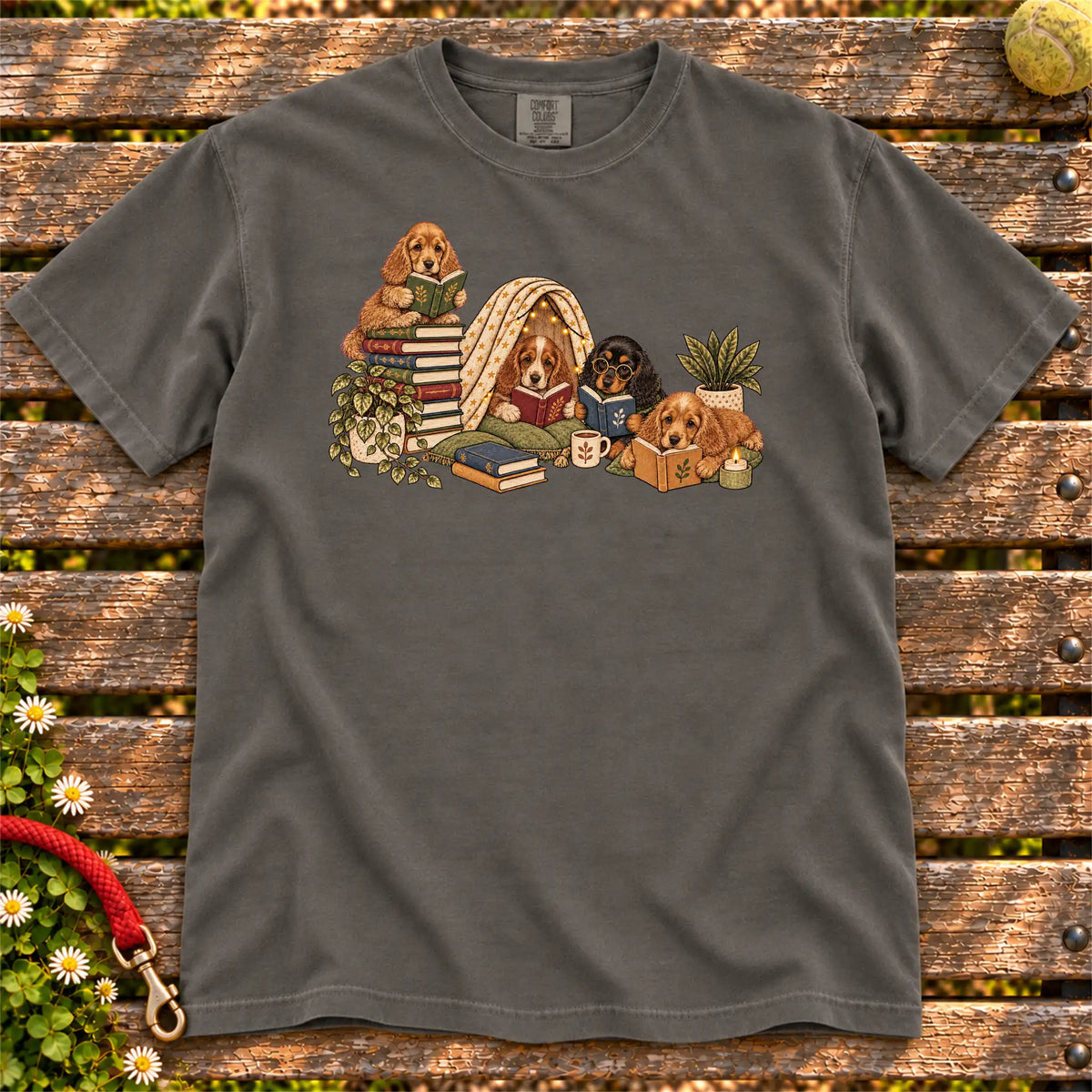 Cocker Spaniel puppies reading books in a cozy blanket fort on a Pepper T-shirt