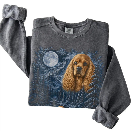 Folded pepper sweatshirt with Cocker Spaniel Winter Moon artwork.