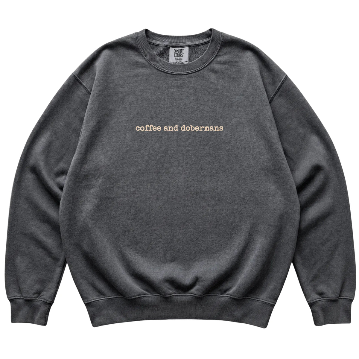Pepper Coffee and Dobermans Comfort Colors sweatshirt laid flat