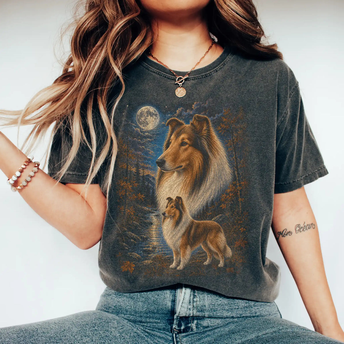 Model wearing a pepper T-shirt with Collie Autumn Moon artwork.