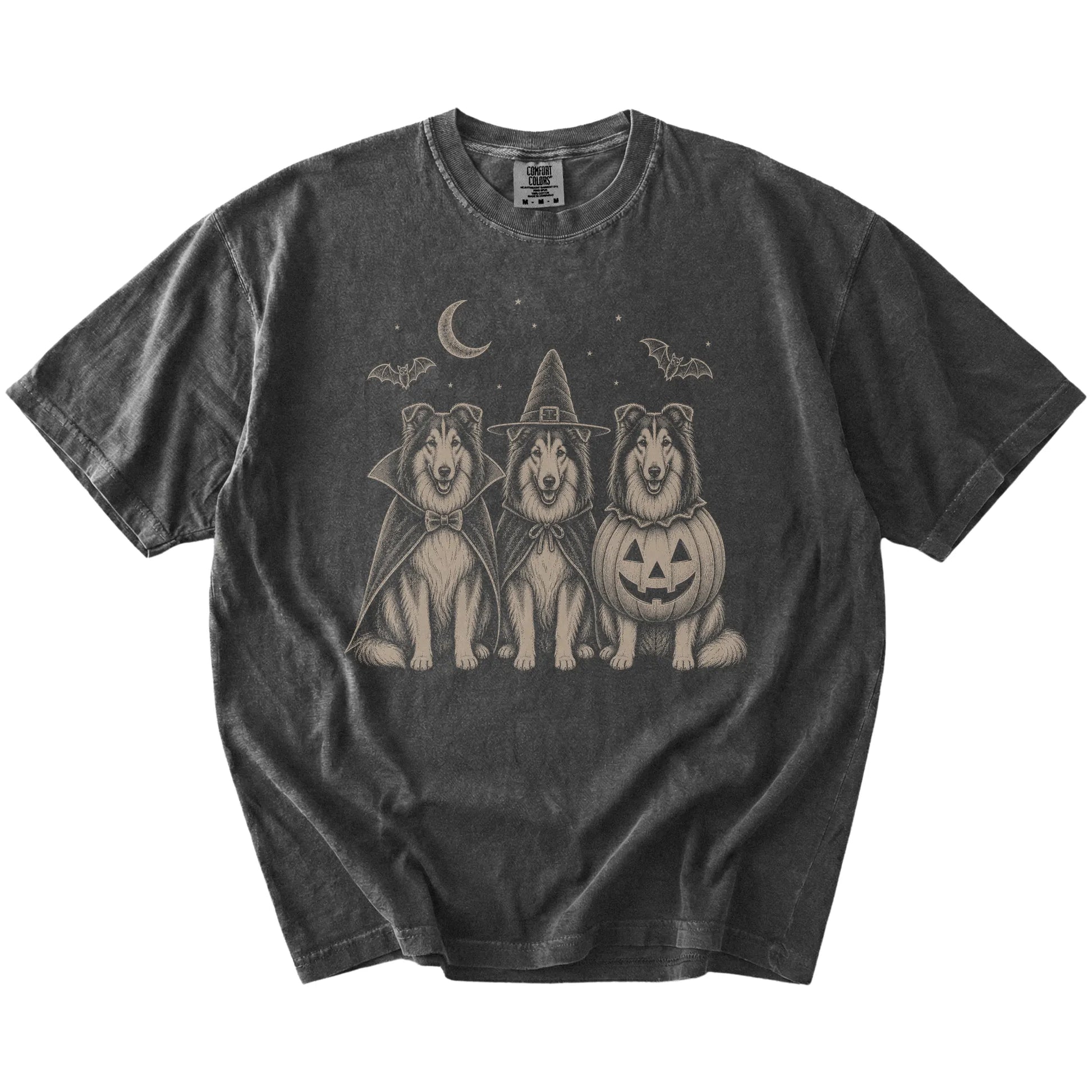 Three Collie dogs dressed for Halloween beneath bats and a crescent moon on a Pepper Comfort Colors® T-shirt