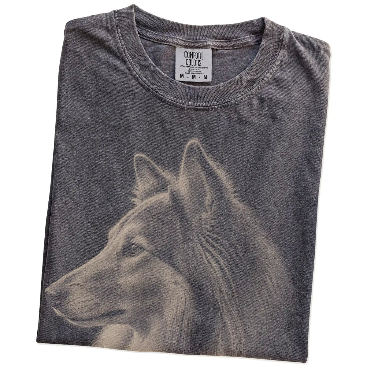 Folded Pepper Comfort Colors® T-shirt showing a detailed photographic portrait of a Collie