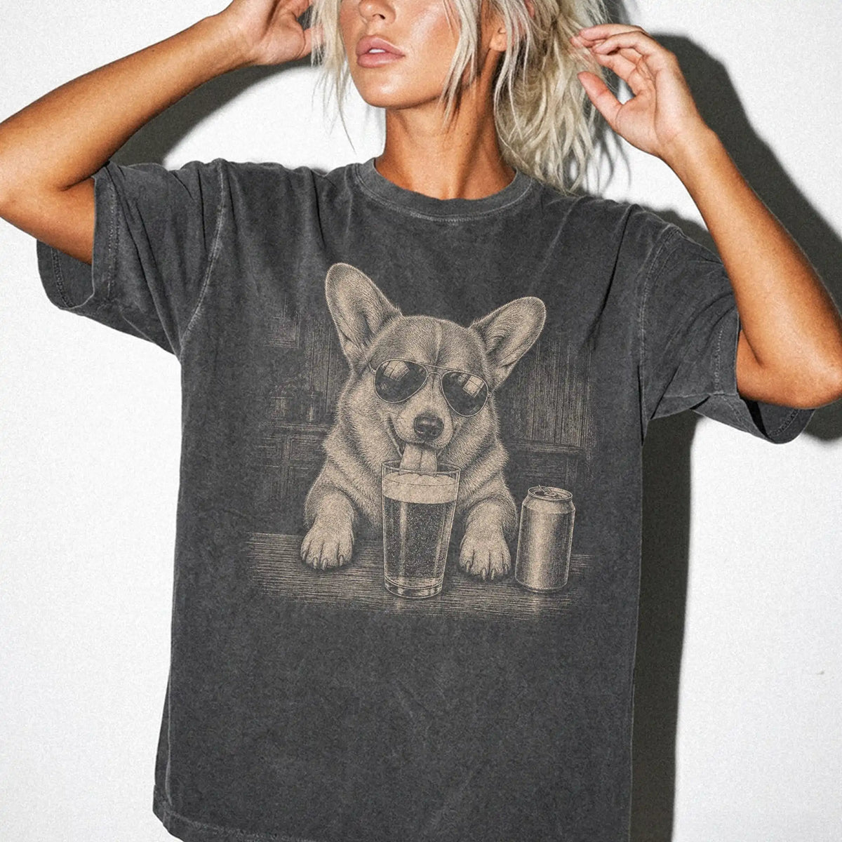 Model wearing a Pepper Comfort Colors® t-shirt with Corgi sneaking a drink from a pint