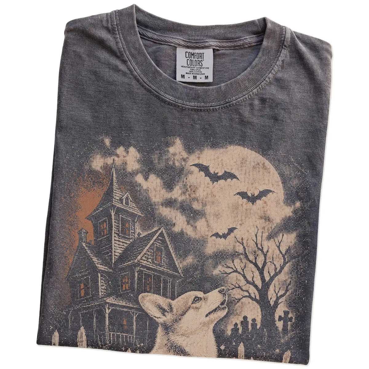 Folded Pepper Comfort Colors® T-shirt showing Corgi in a vintage haunted-house scene