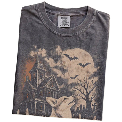 Folded Pepper Comfort Colors® T-shirt showing Corgi in a vintage haunted-house scene