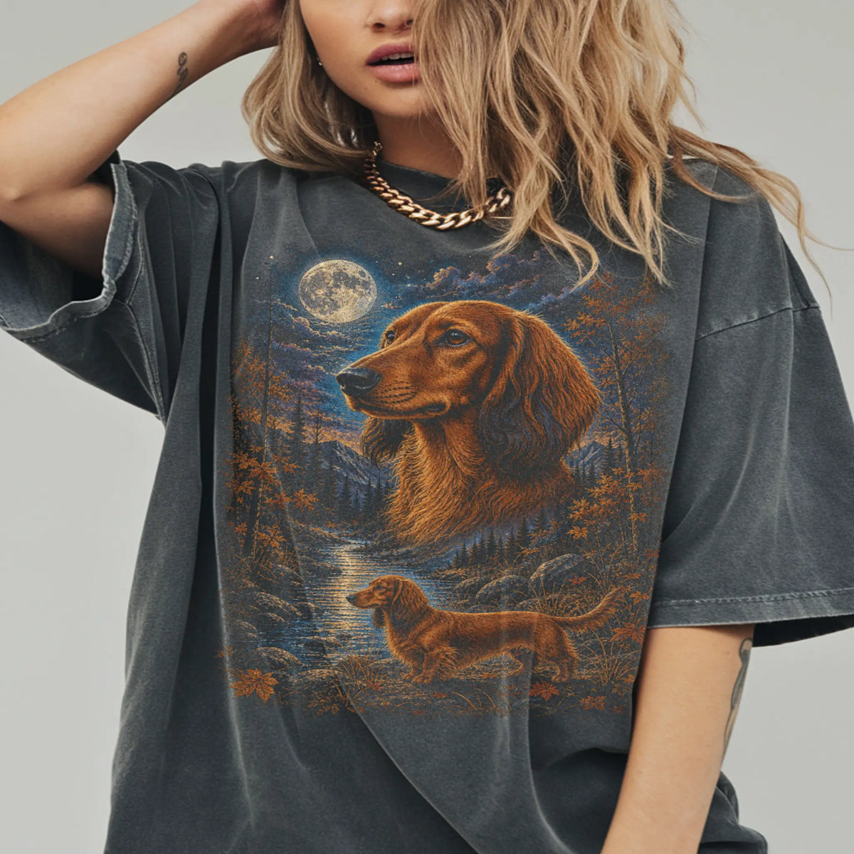 Model wearing a pepper T-shirt with Dachshund Autumn Moon artwork.
